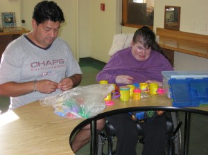 Julio and Moselle create with Play-doh